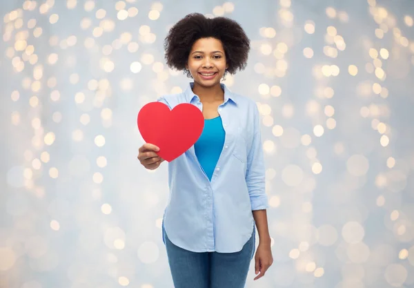 Happy african american woman with red heart shape — Stock Photo, Image