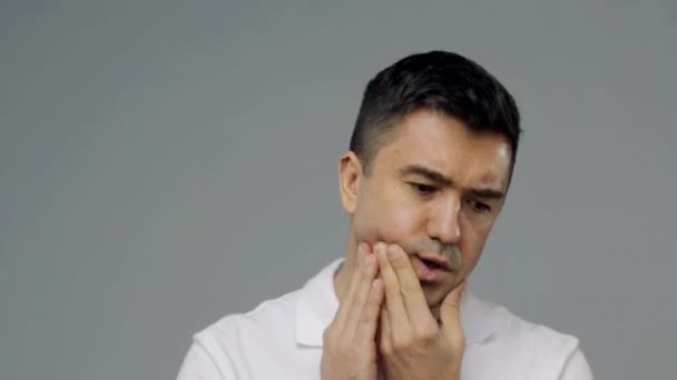 Unhappy man suffering from toothache — Stock Video