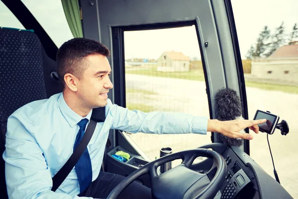 Bus driver entering address to gps navigator — Stock Photo, Image