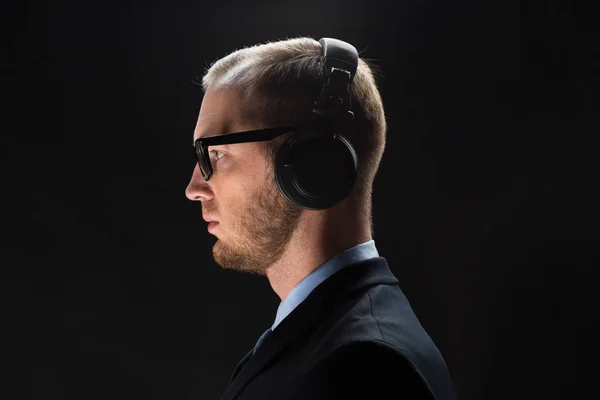 Businessman in headphones — Stock Photo, Image