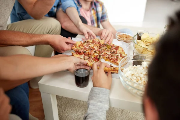 Close up of people taking pizza slices at home — Stock Photo, Image