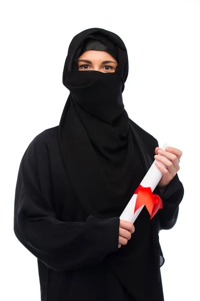 Muslim woman in hijab with diploma over white — Stock Photo, Image