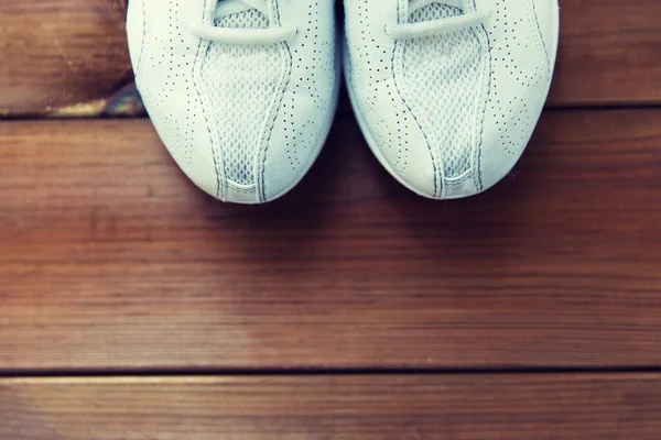 Close up of sneakers on wooden floor — Stock Photo, Image
