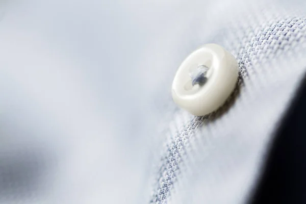 Close up of blue shirt button — Stock Photo, Image