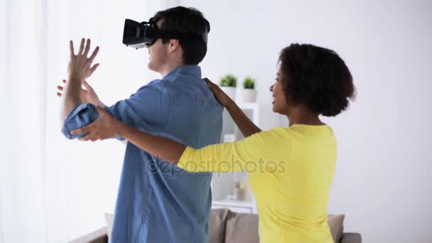 Happy couple with virtual reality headset at home — Stock Video