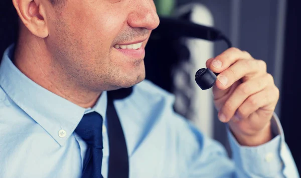 Close up of happy bus driver talking to microphone — Stock Photo, Image