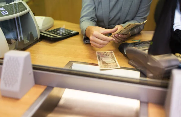 Clerk counting cash money at bank office — Stock Photo, Image