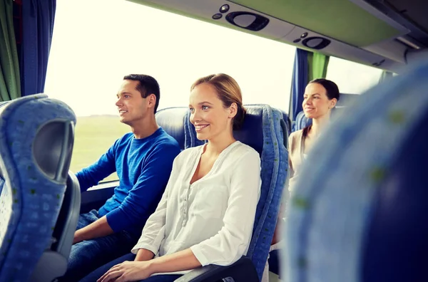 Group of happy passengers in travel bus — Stock Photo, Image
