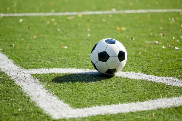 Soccer ball on football field — Stock Photo, Image