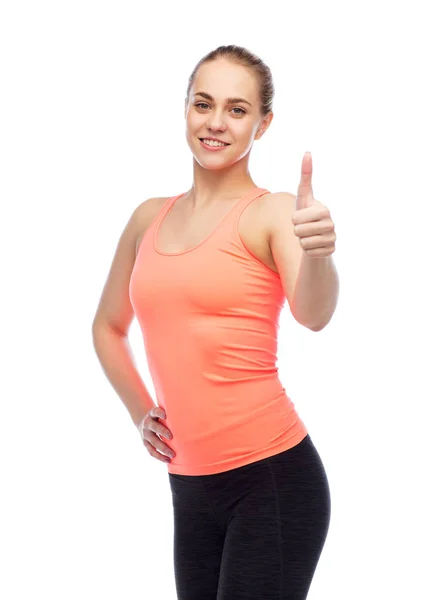 Feliz esportivo jovem mulher mostrando polegares para cima — Fotografia de Stock