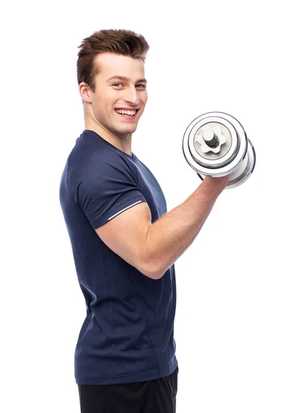 Happy sportive young man with dumbbell — Stock Photo, Image