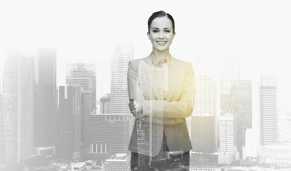 Smiling businesswoman over city buildings — Stock Photo, Image