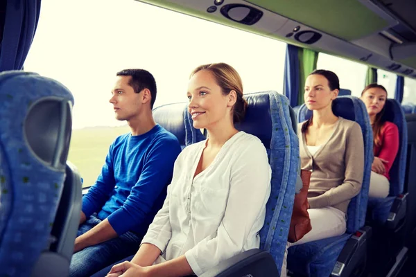 Group of happy passengers in travel bus — Stock Photo, Image