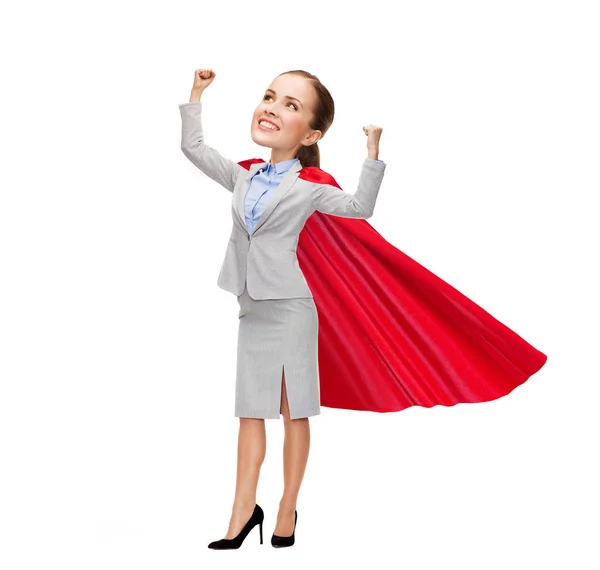 Young smiling businesswoman in red superhero cape — Stock Photo, Image