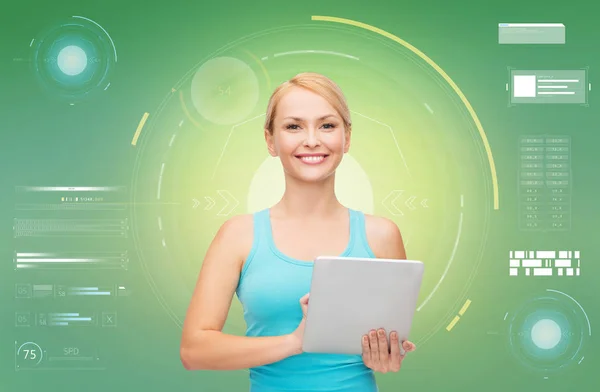 Happy smiling sporty woman with tablet pc — Stock Photo, Image