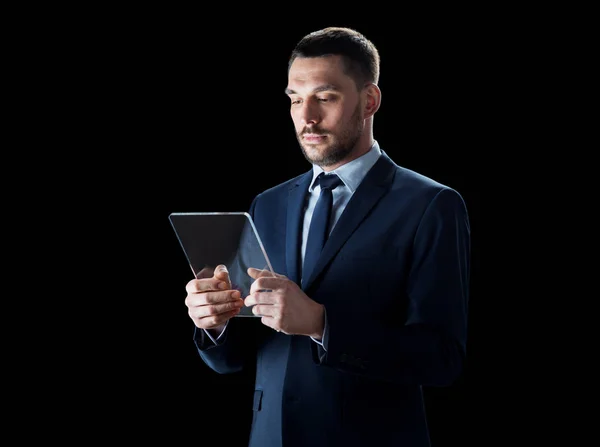 Businessman in suit with transparent tablet pc — Stock Photo, Image