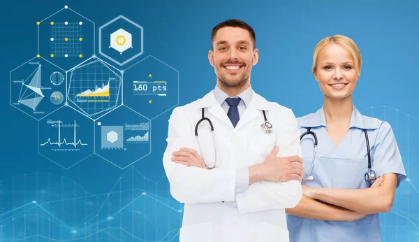 Smiling doctors with stethoscopes over charts — Stock Photo, Image
