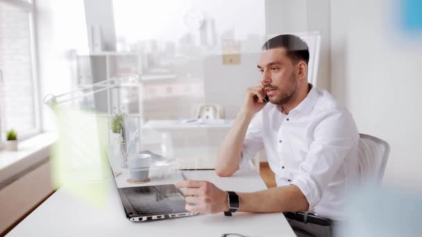 Businessman calling on smartphone at office — Stock Video