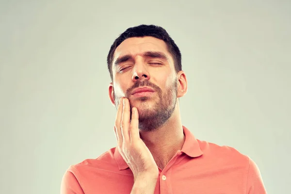 Unhappy man suffering from toothache — Stock Photo, Image