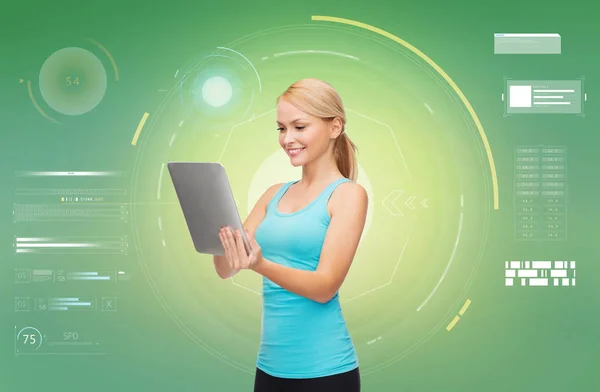 Happy smiling sporty woman with tablet pc — Stock Photo, Image