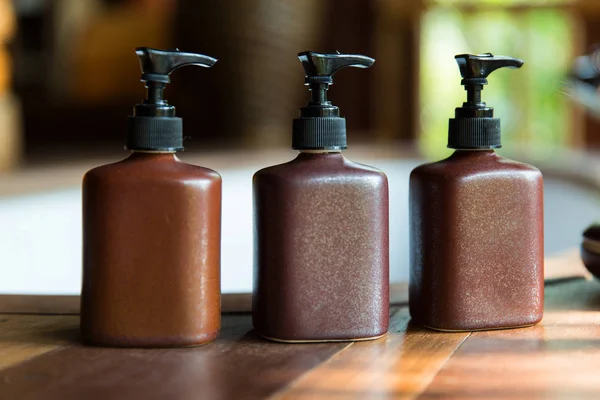 Bottles with liquid soap or lotion at bathroom — Stock Photo, Image