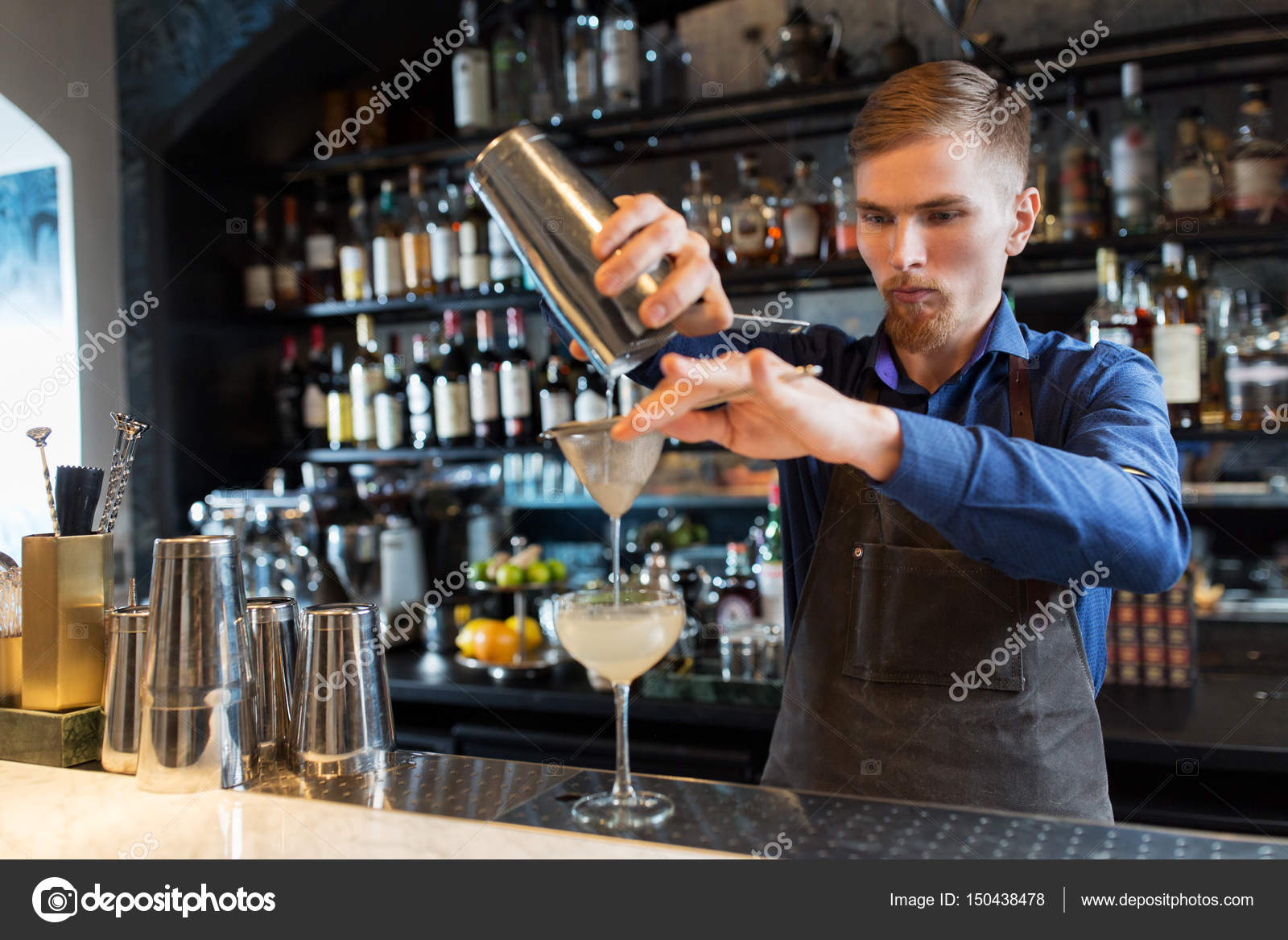 Barman with shaker preparing cocktail at bar Stock Photo by  ©Syda_Productions 150438478