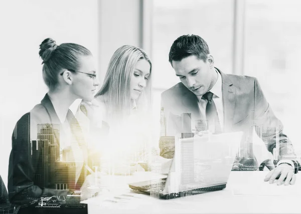 Business team with laptop having meeting at office — Stock Photo, Image