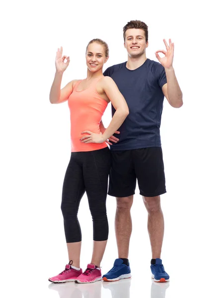 Happy sportive man and woman — Stock Photo, Image