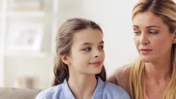 Mother and girl turning to each other at home — Stock Video