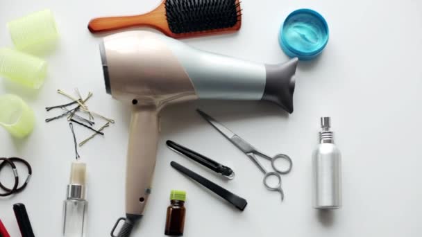 Hair styling devices on white background — Stock Video
