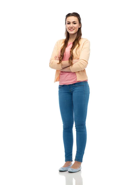 Gelukkig lachende jonge vrouw in het vest en jeans — Stockfoto