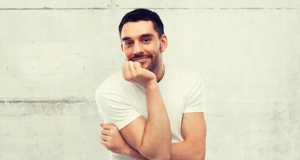 Smiling man over gray background — Stock Photo, Image