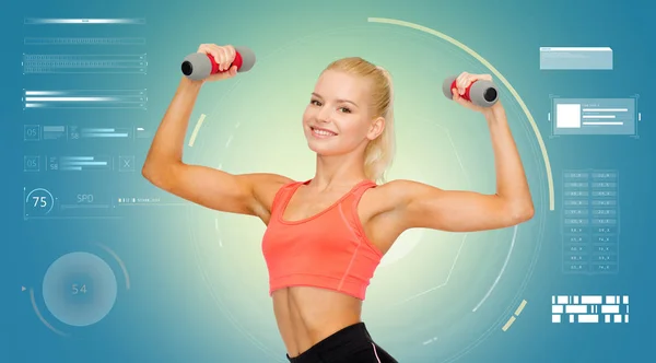 Happy young sporty woman exercising with dumbbells — Stock Photo, Image