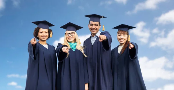 Happy students or bachelors pointing finger at you — Stock Photo, Image