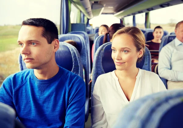 Happy couple or passengers in travel bus — Stock Photo, Image