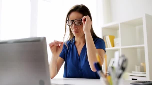 Woman with laptop and notebook at home or office — Stock Video