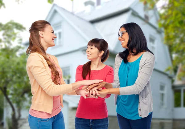 International group of women with hands together — Stock Photo, Image