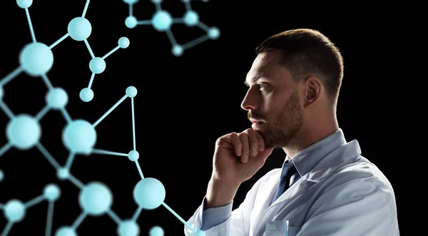 Scientist looking at molecule projection — Stock Photo, Image