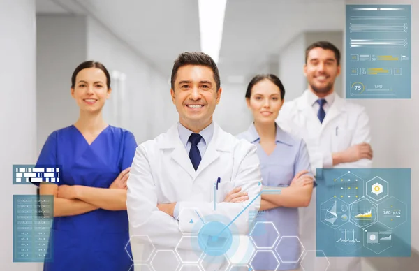 Happy group of medics or doctors at hospital — Stock Photo, Image