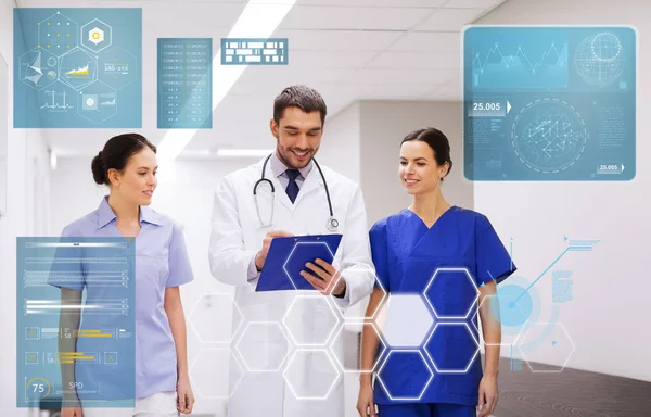 Group of medics at hospital with clipboard — Stock Photo, Image