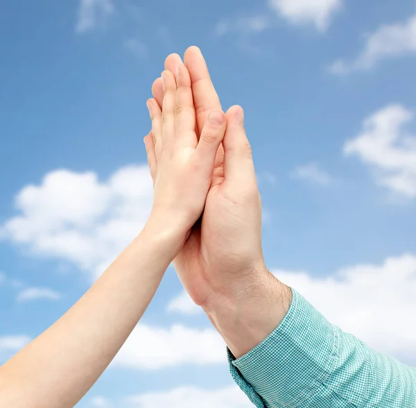 Father and child hands making high five over sky — Stock Photo, Image