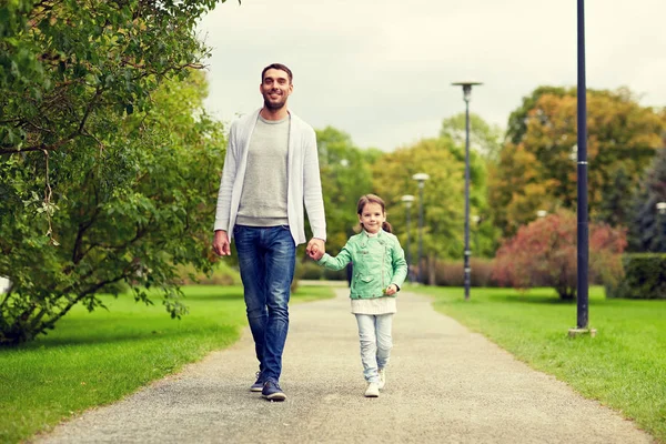 Happy family walking in summer park — Stock Photo, Image