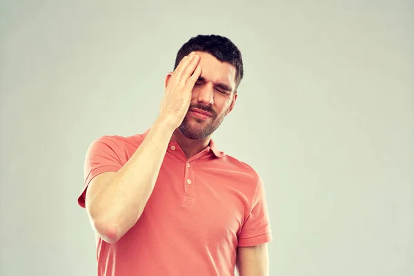Unhappy man suffering from head ache — Stock Photo, Image