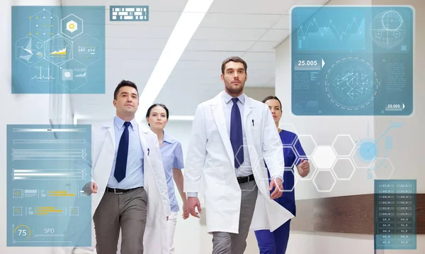 Group of medics walking along hospital — Stock Photo, Image