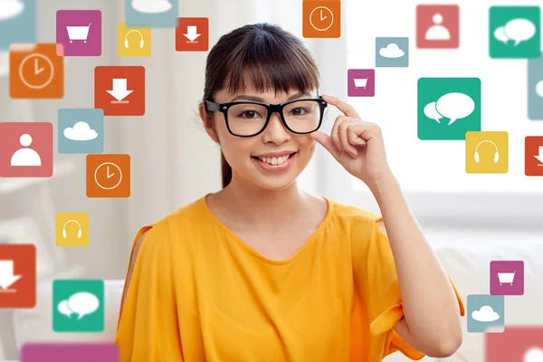 Happy asian young woman in glasses at home — Stock Photo, Image