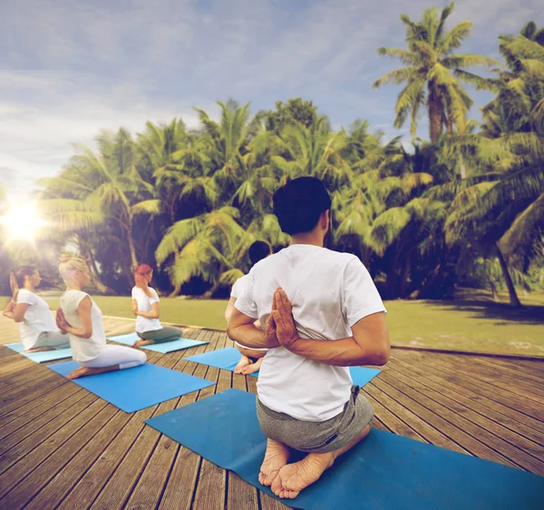 Group of people making yoga exercises outdoors — Stock Photo, Image