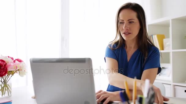 Woman with laptop and notebook at home or office — Stock Video