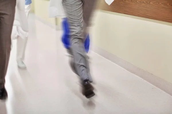 Close up of medics or doctors running at hospital — Stock Photo, Image