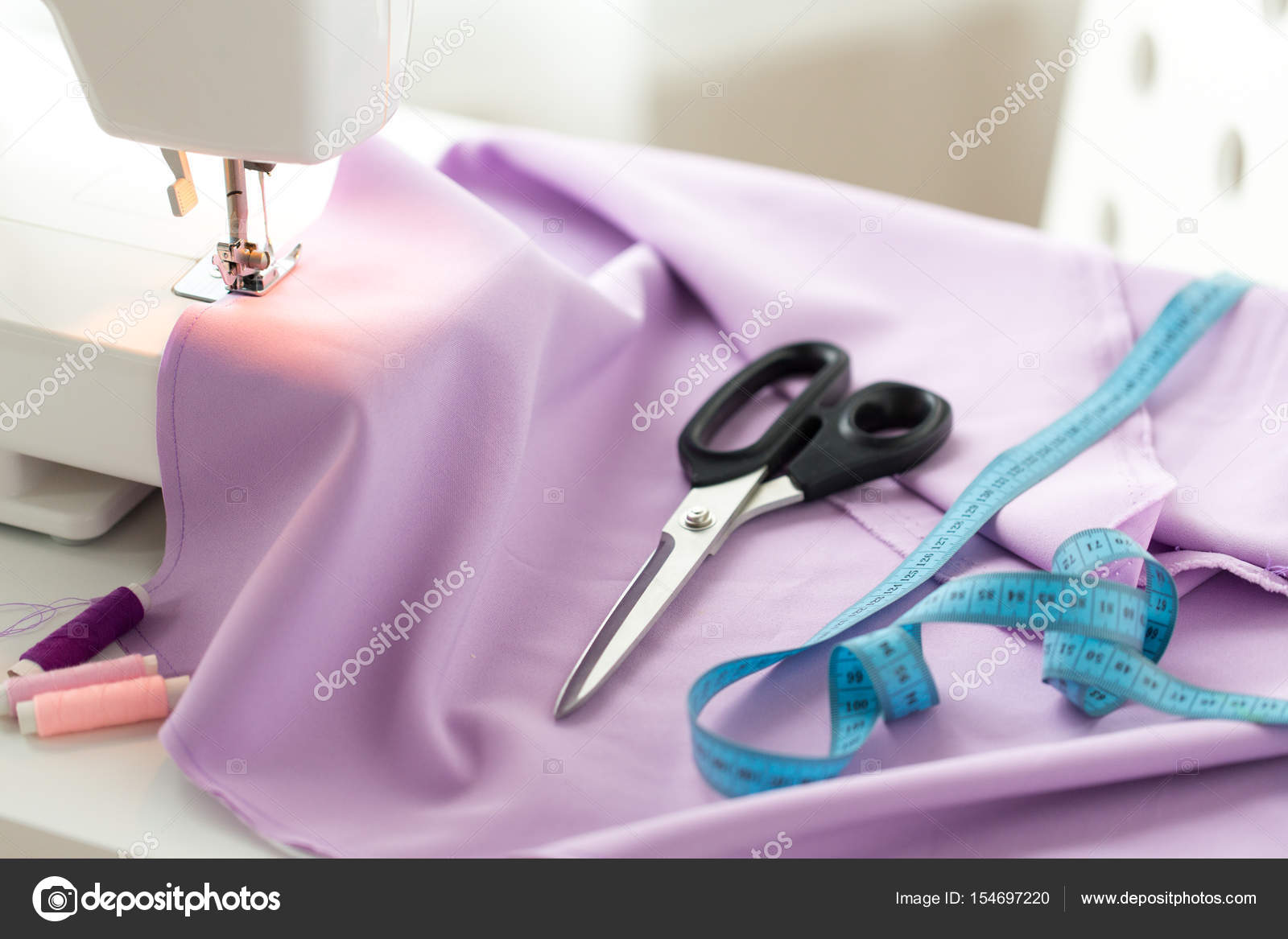Sewing machine, scissors, tape measure and fabric — Stock Photo © Syda