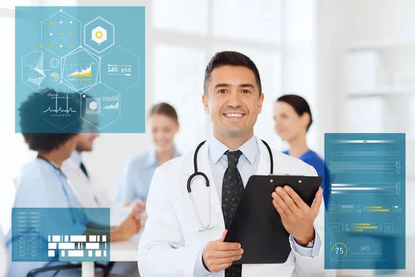 Happy doctor with clipboard over medical team — Stock Photo, Image